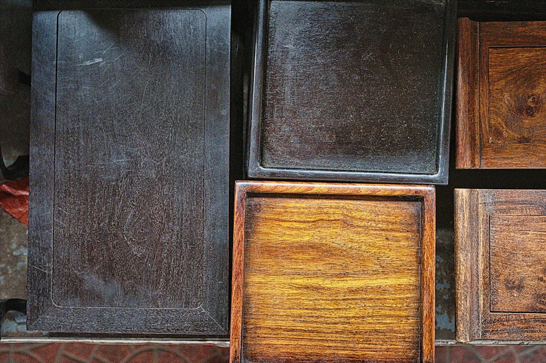 Side by side comparison of stained wood cabinets and painted cabinets